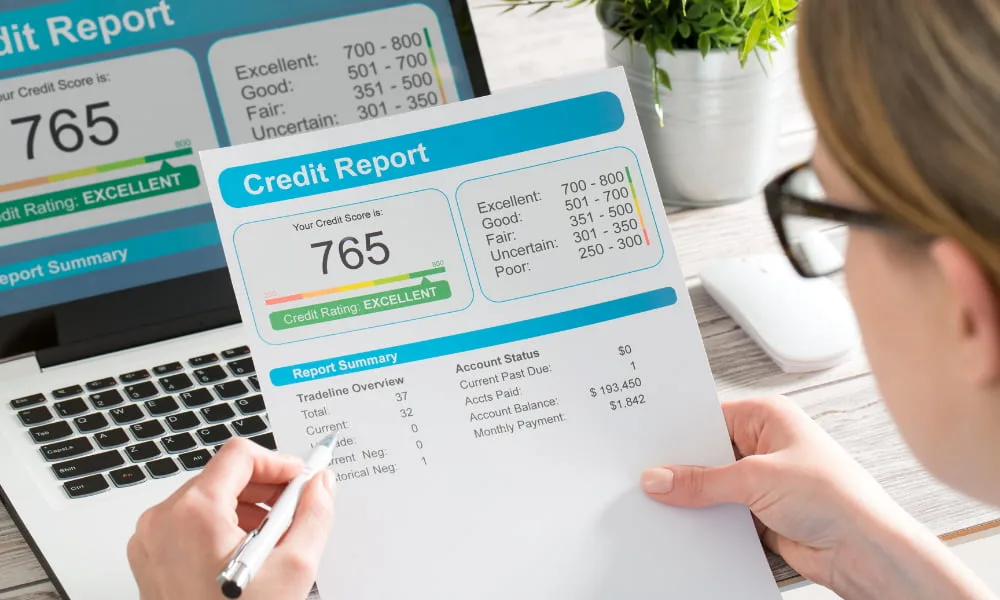 Person with good credit looking at credit score drop