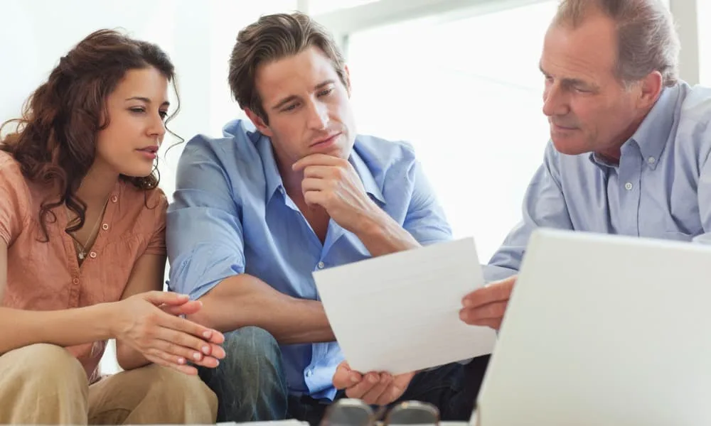 A couple doing some early retirement planning with an advisor.