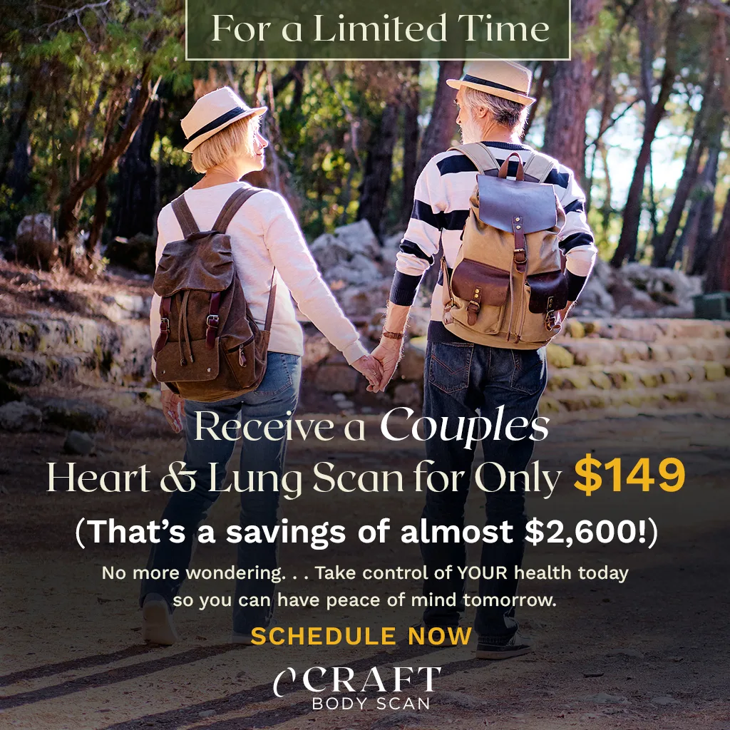 Elderly couple hiking holding hands.