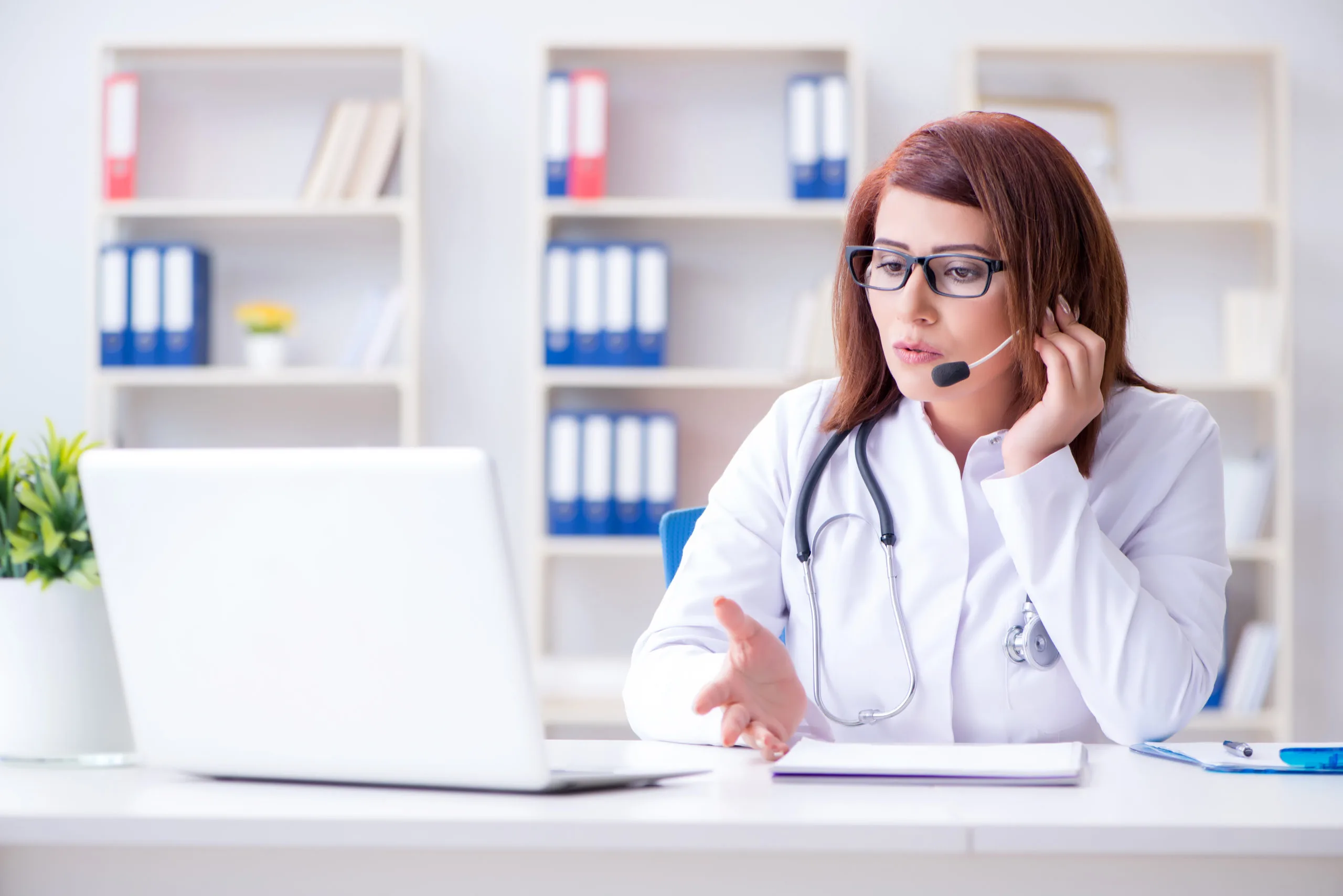 Clinician speaking with a patient during a telehealth consultation