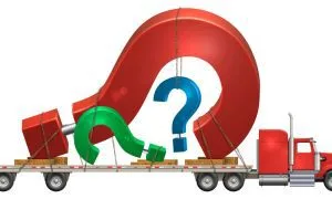 A graphic of a flatbed or car hauler transporting three giant question marks.