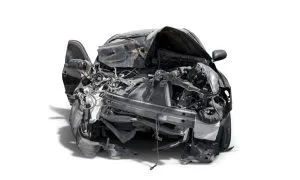 Front view of a very badly damaged car, signifying what happens when your car is totaled.