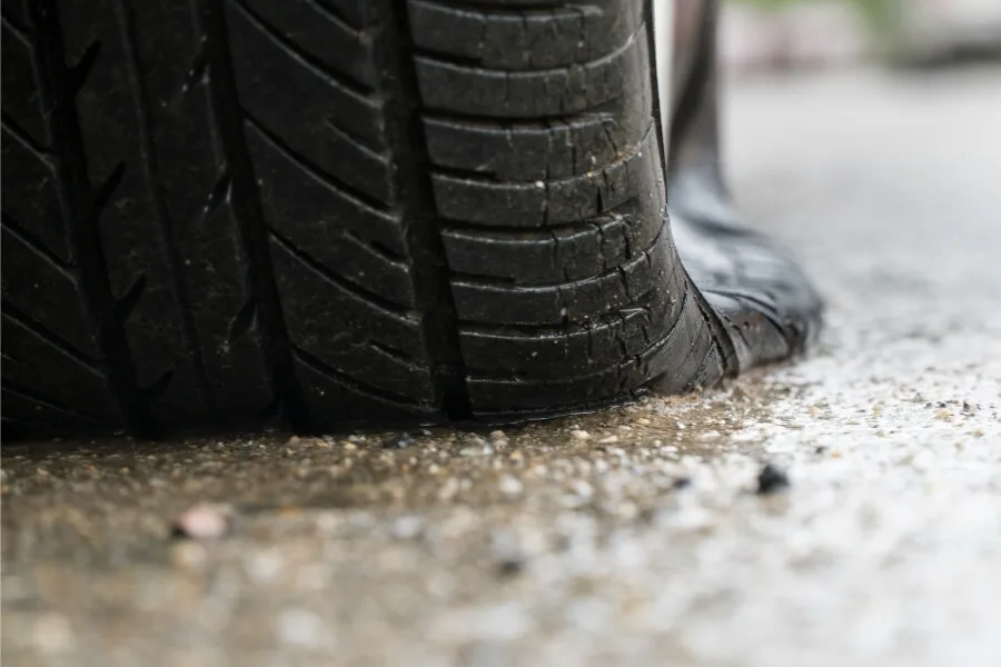 electric car with flat tire