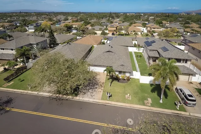 An Aerial View of Pi'ilani Village Homes with the ocean in the distance. 