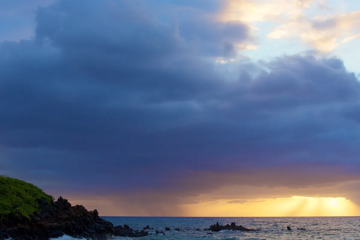Maui Real Estate Market Update Q4 2023 Vol. 3 2 A rain squall passing offshore from Wainapanapa State Park in Hana