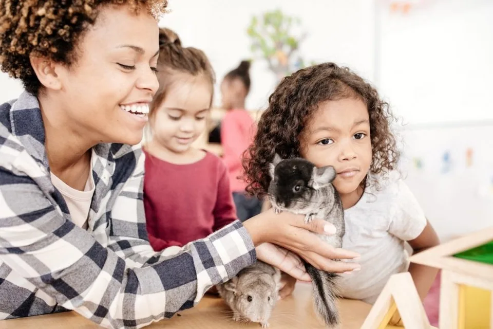 Would My Child Benefit From An Emotional Support Animal? 9 Mother and Child playing with an emotional support animal