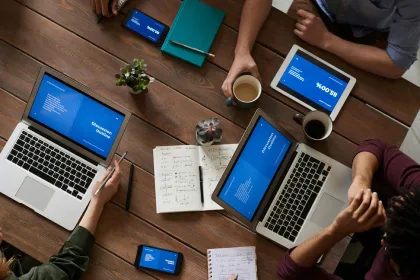 People Working Around Laptop