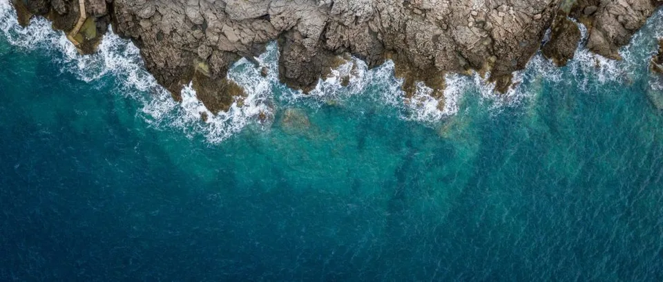 Waves crashing at low tide