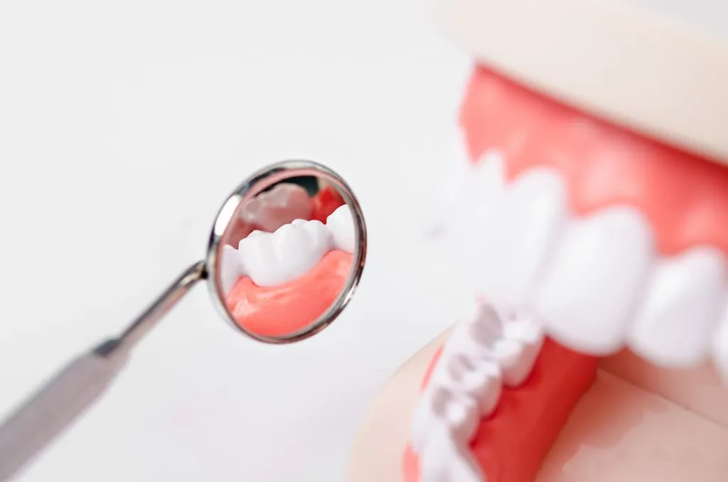 dental mirror reflecting gum health during a periodontal examination in austin