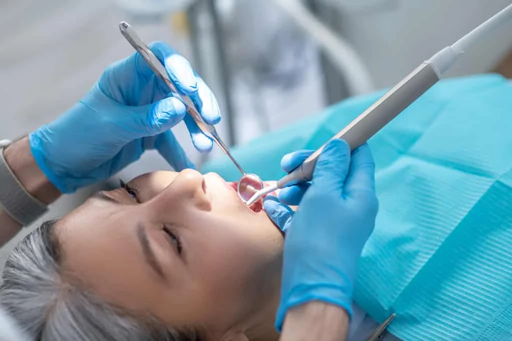 root planing treatment being performed as a non-surgical periodontal disease treatment option