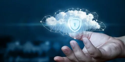 Person's hand holding a digital cloud with a padlock symbol, representing cybersecurity and data protection concept.
