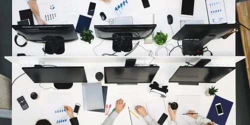 young-team-working-on-computers-at-modern-office-4ZP37DL-1