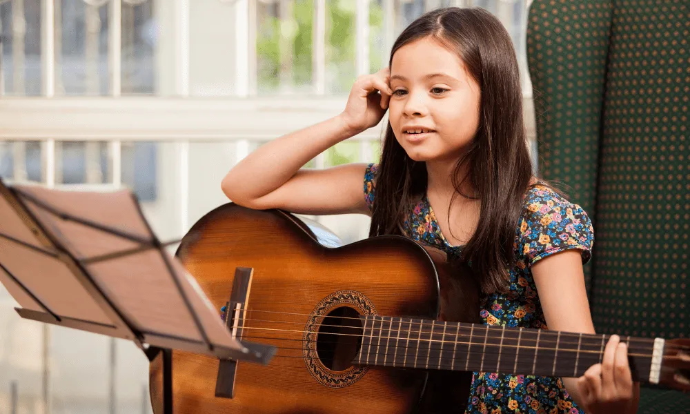 Guide to Learn the Differences Between Guitars: Acoustic, Classical or Electric. Which One Fits You? 4 girl taking classical guitar lessons