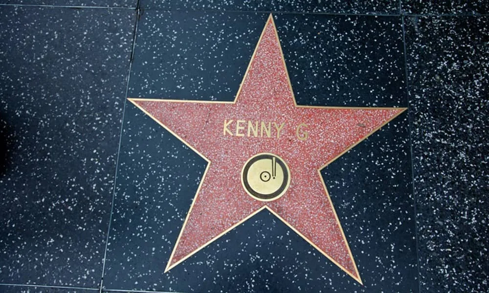 Kenny G’s Hollywood Walk of Fame star symbolizing the popularity of Kenny G songs.