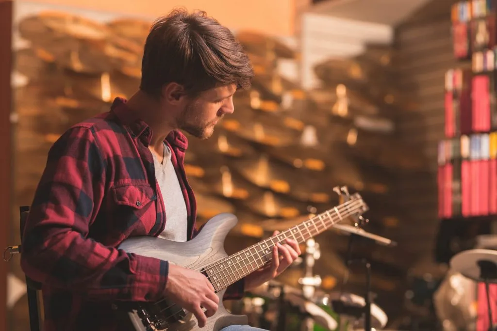 artist playing guitar