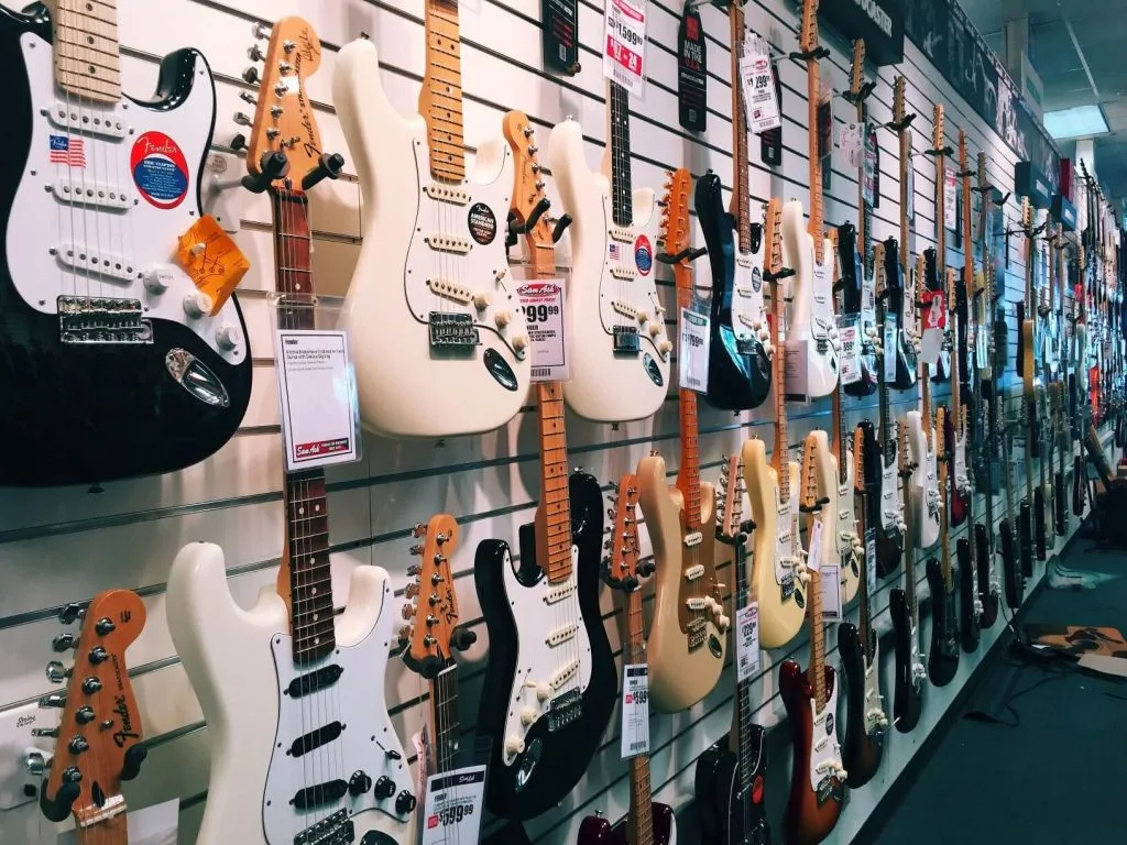 different guitars on display at a music store
