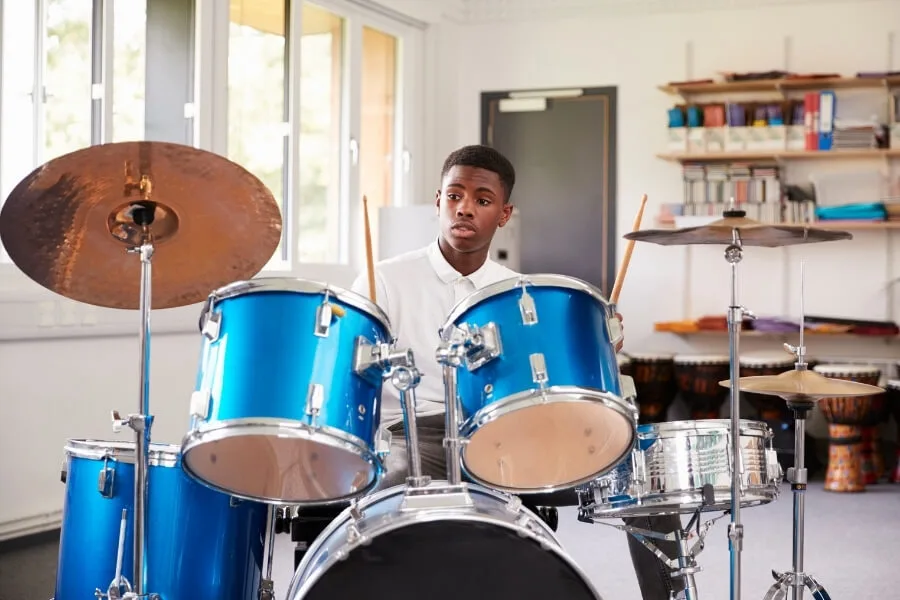 A boy playing drum