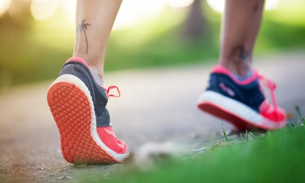 shoes of a runner on a trail