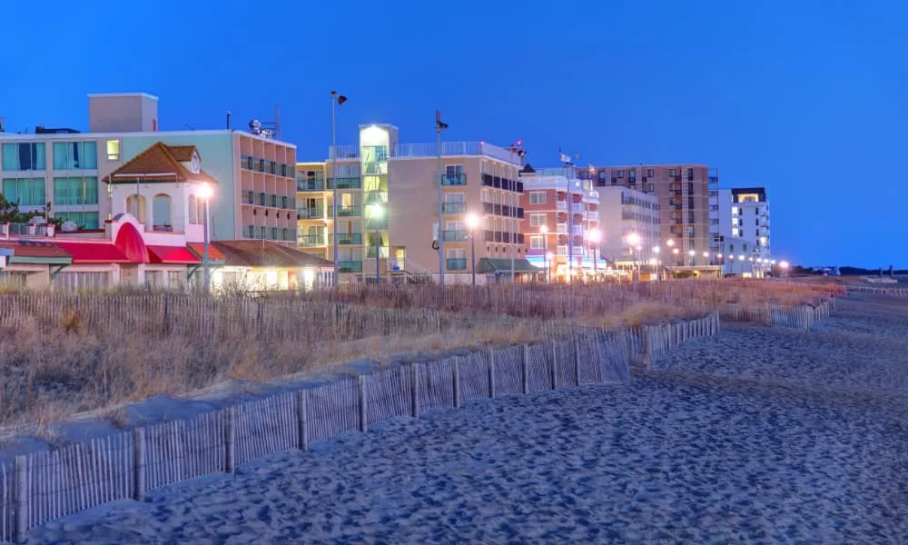 a view of rehoboth beach boardwalk at dusk