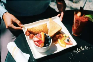 Server holding Egg breakfast in rehoboth beach delaware
