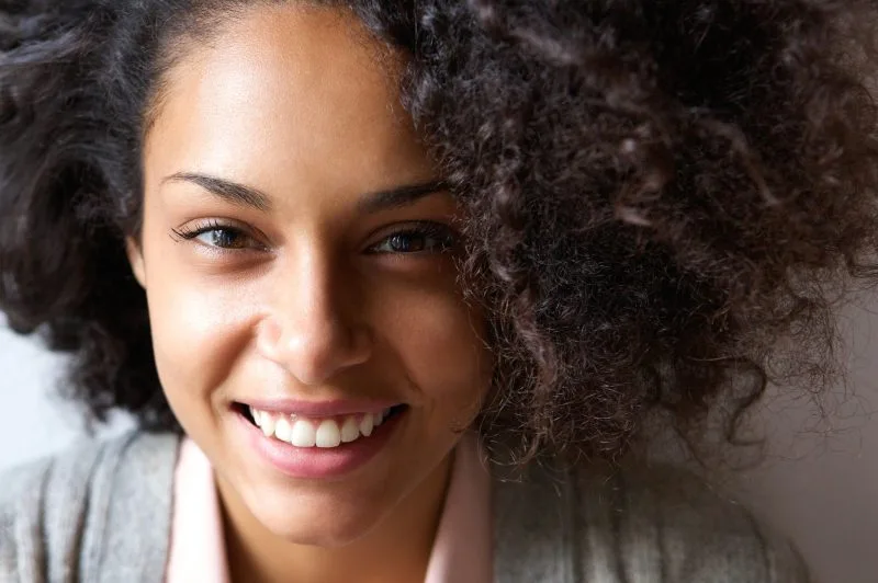 Close up portrait of a beautiful young african american woman smiling